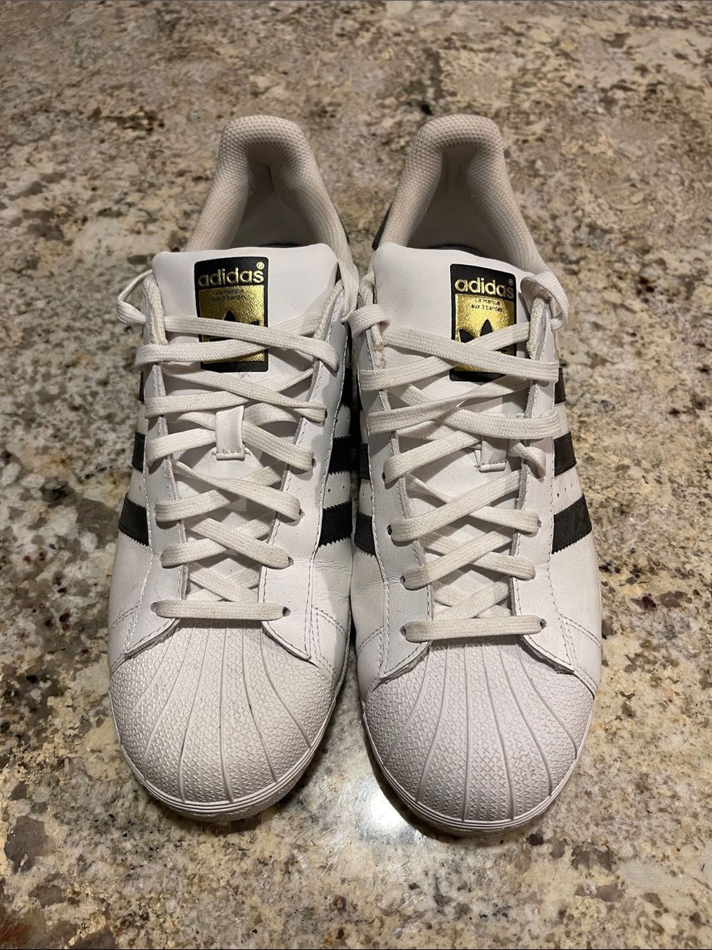 adidas White Sneakers with Black Stripes and Gold Tongue Logo